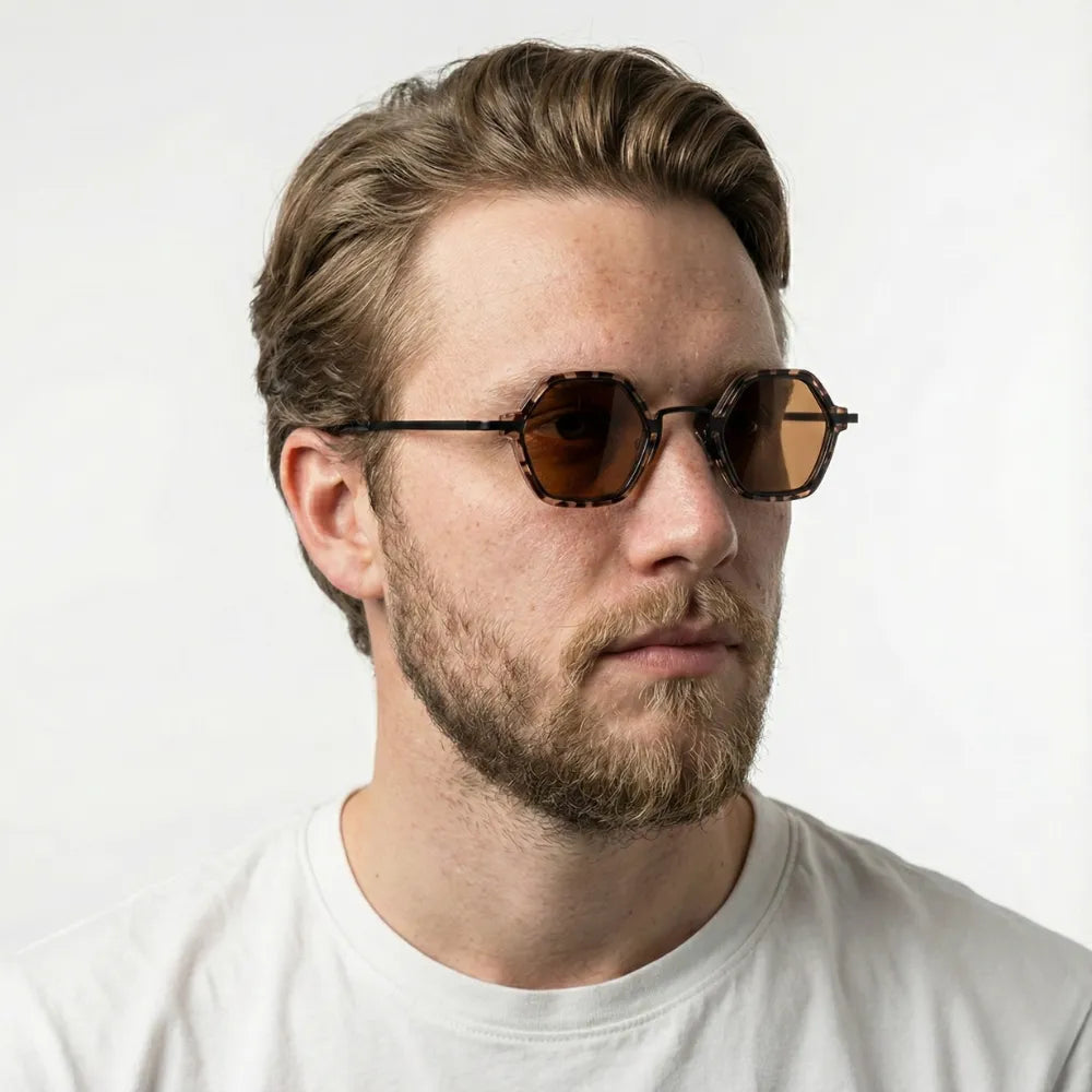 Small hexagonal sunglasses, model portrait — HARO Cap-Ferrat 1925