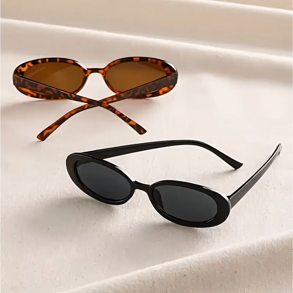 Cat-eye acetate sunglasses with white frame and black lenses, side angle — HARO Forte dei Marmi