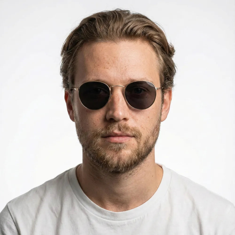Thin round metal sunglasses worn outdoors — HARO Portovenere 1952 lifestyle